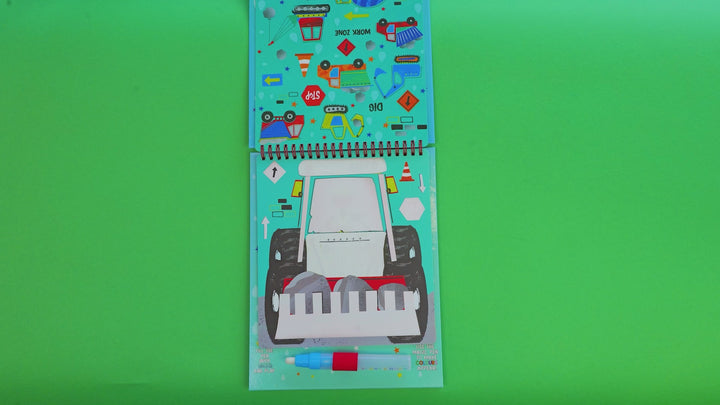 A video of a children's spiral-bound coloring pad titled 'Magic Colour-In Pad' with dinosaur artwork, shown standing against a plain white background. The package includes a blue and orange marker visible through a clear window near the bottom.